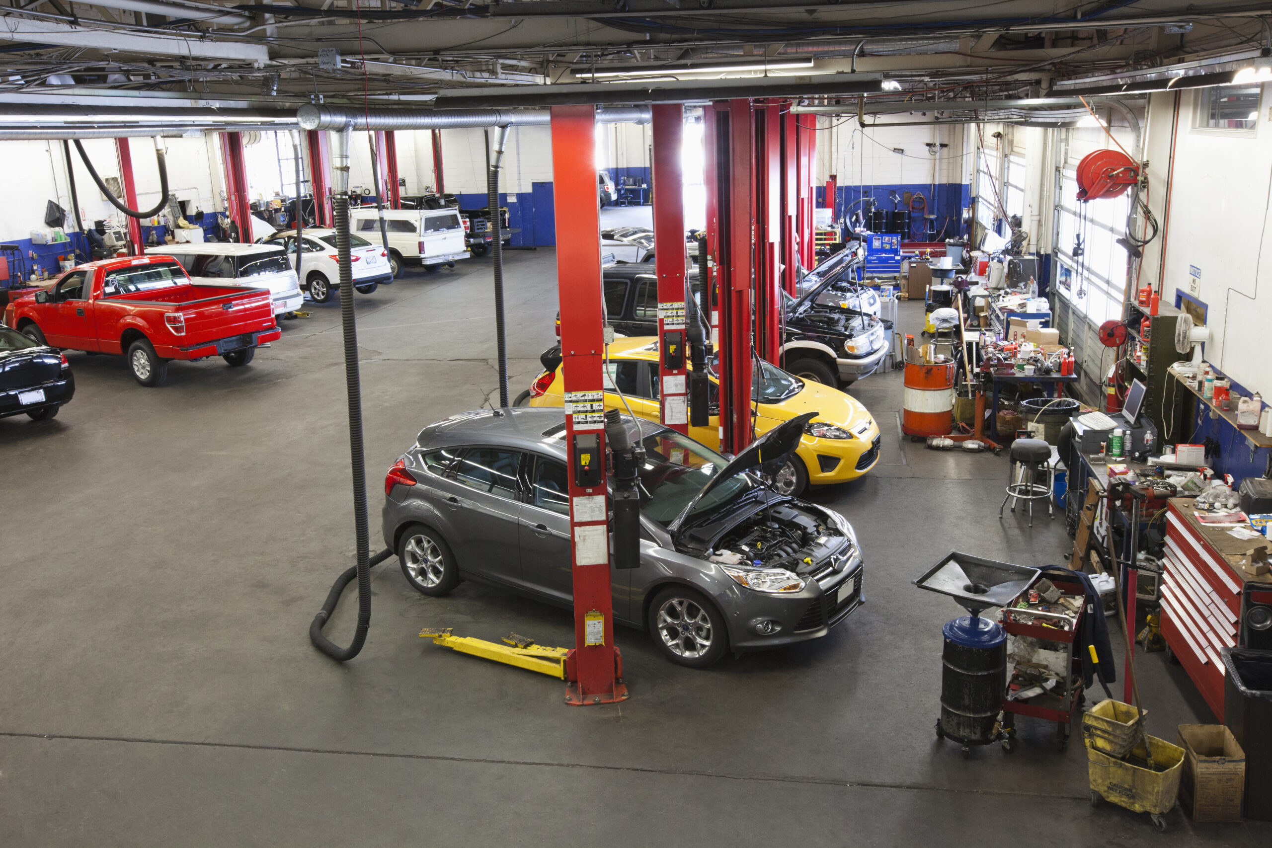 Seattle,United States,Rows of cars and trucks in auto repair shop Auto Garage Flooring