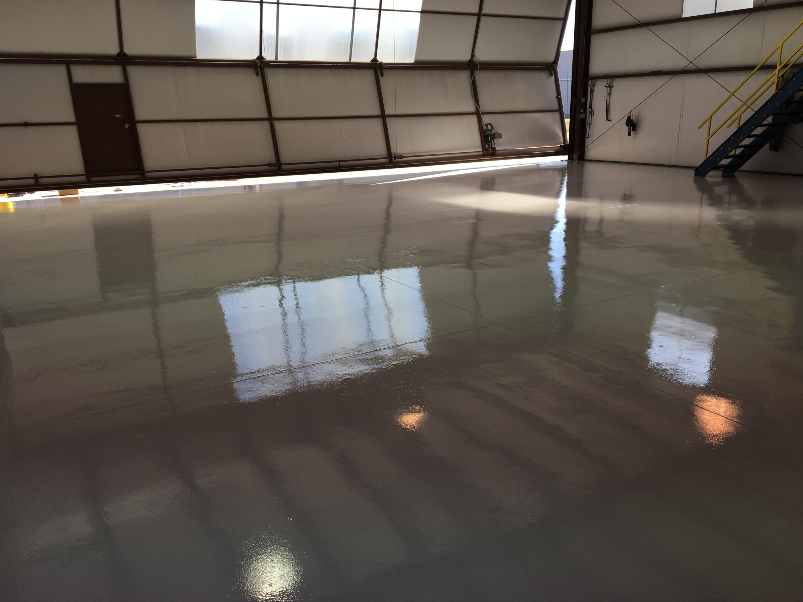 Aerospace defense facility with completed aliphatic urethane topcoat flooring