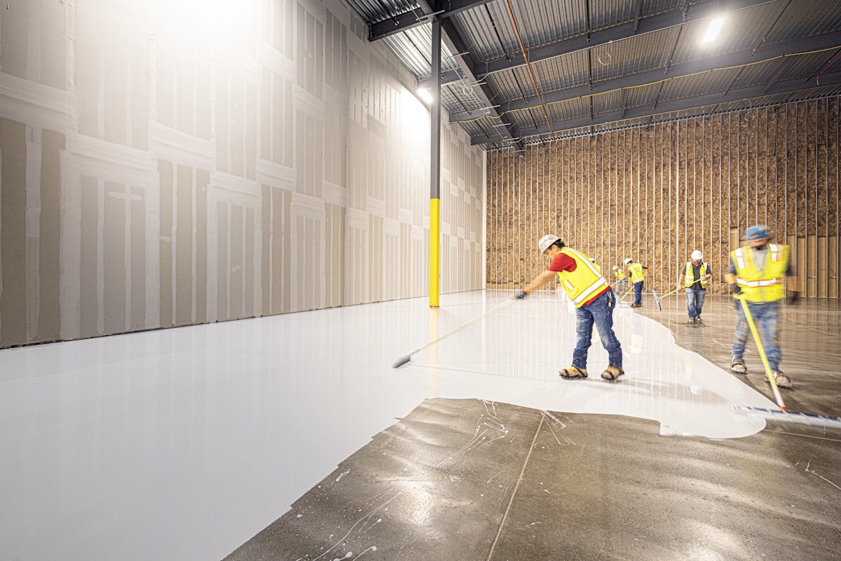 Industrial floor coating application in commercial maintenance facility