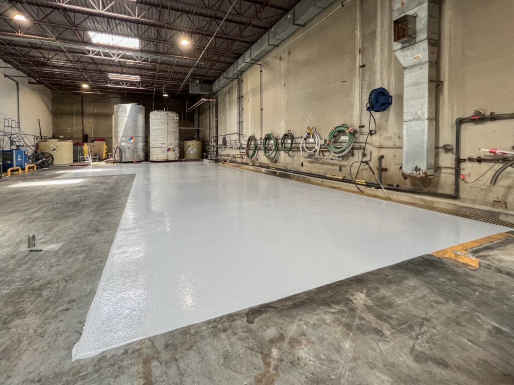 Freshly coated 100% solids epoxy floor in a chemical processing facility