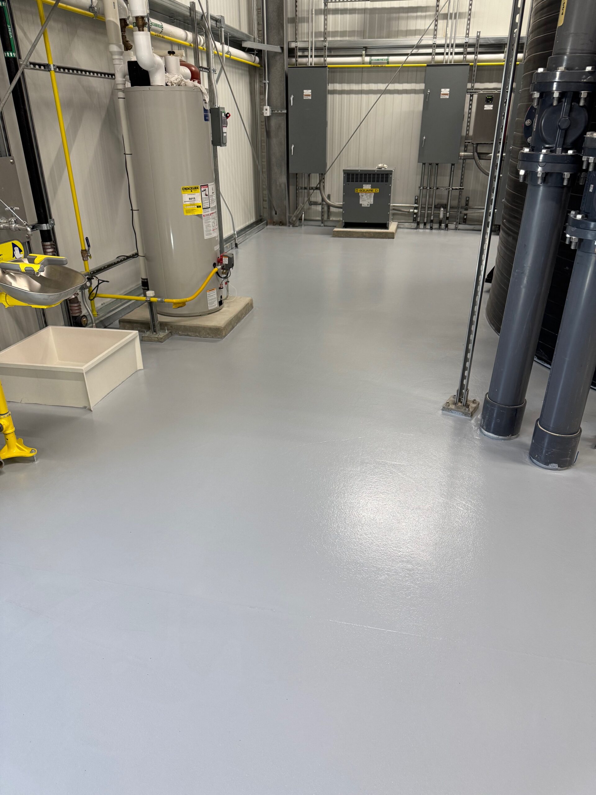 Interior view of a chemical processing facility with a smooth novolac epoxy floor.