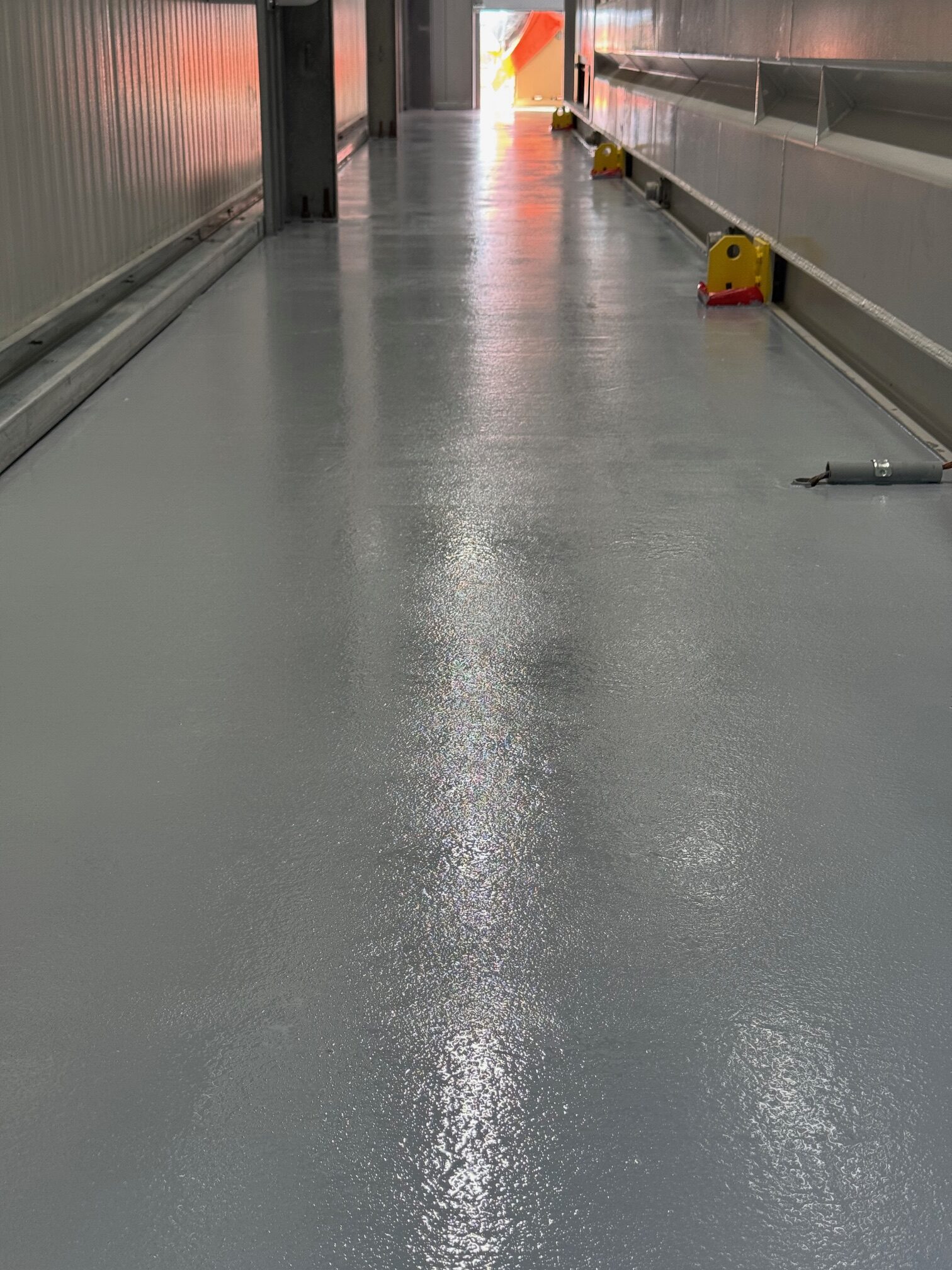 A smooth, freshly coated floor in a chemical processing facility.
