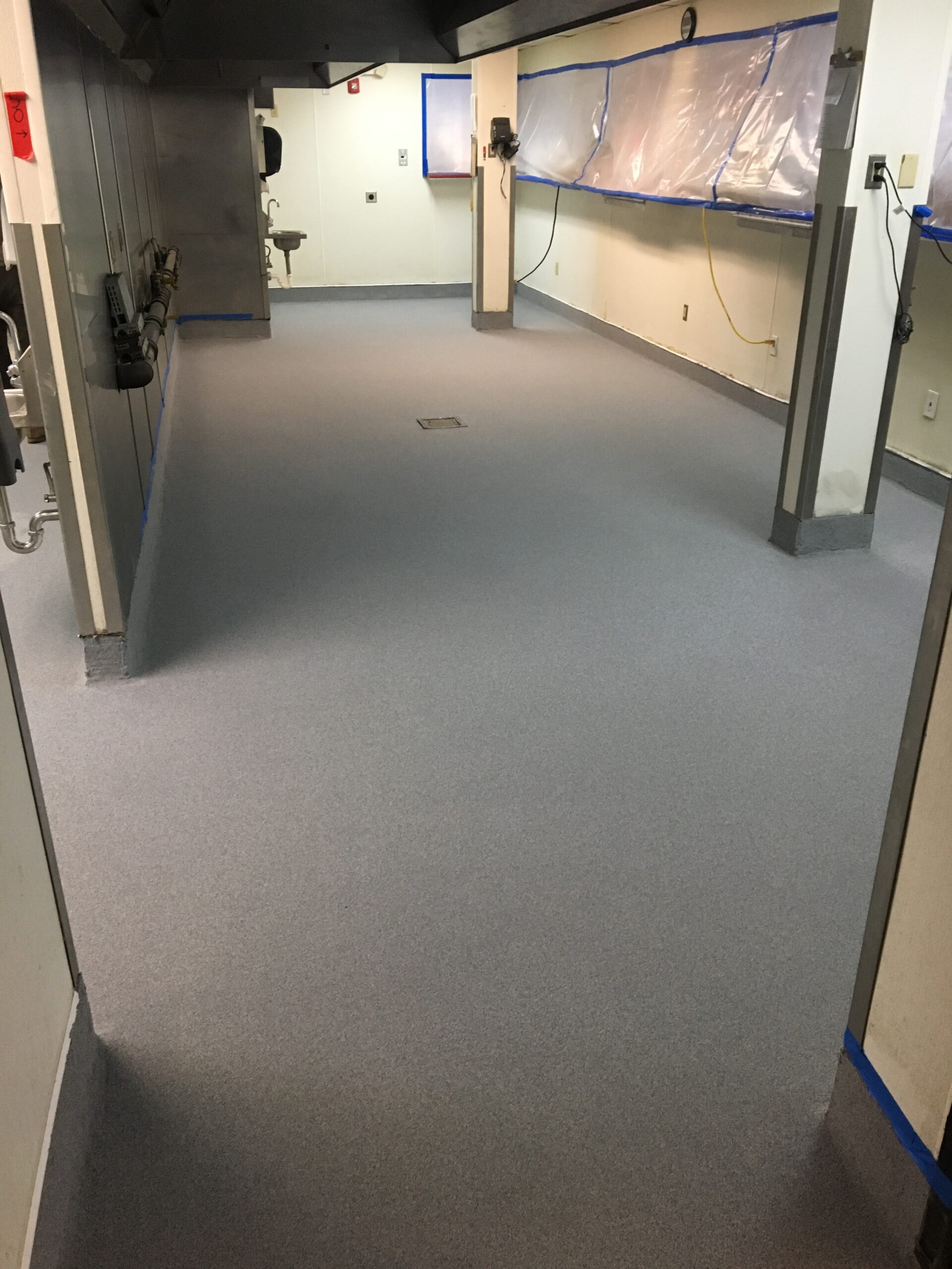 A clean epoxy floor in a food processing area after installation.