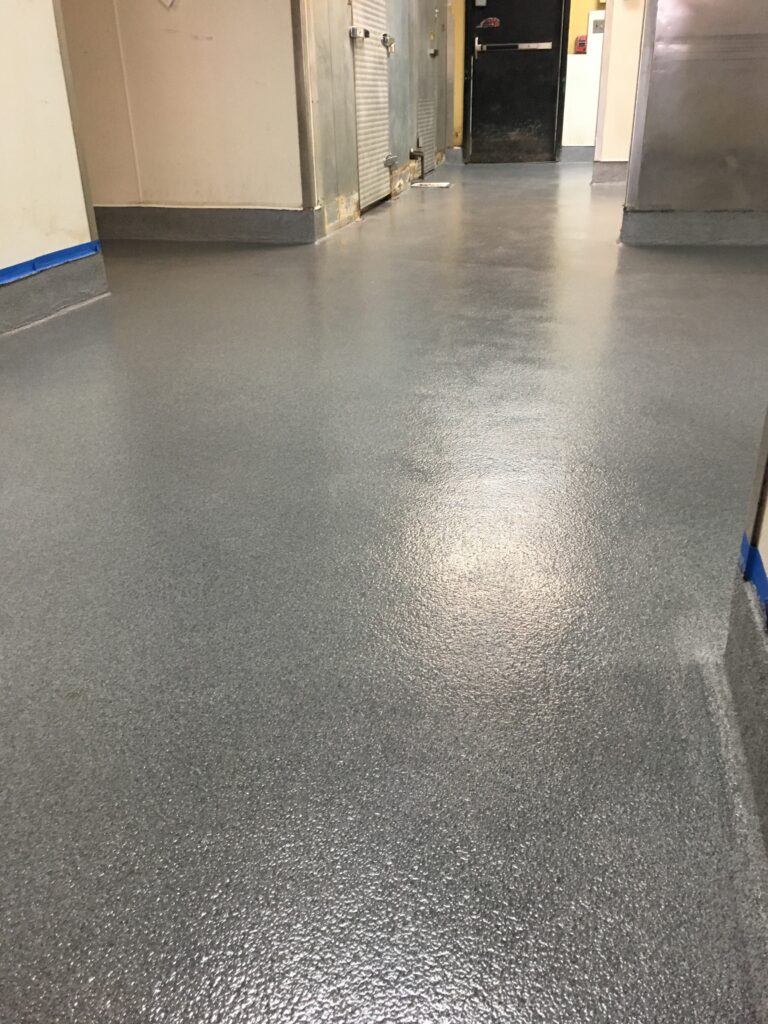 A glossy quartz broadcast epoxy floor in a food processing area.
