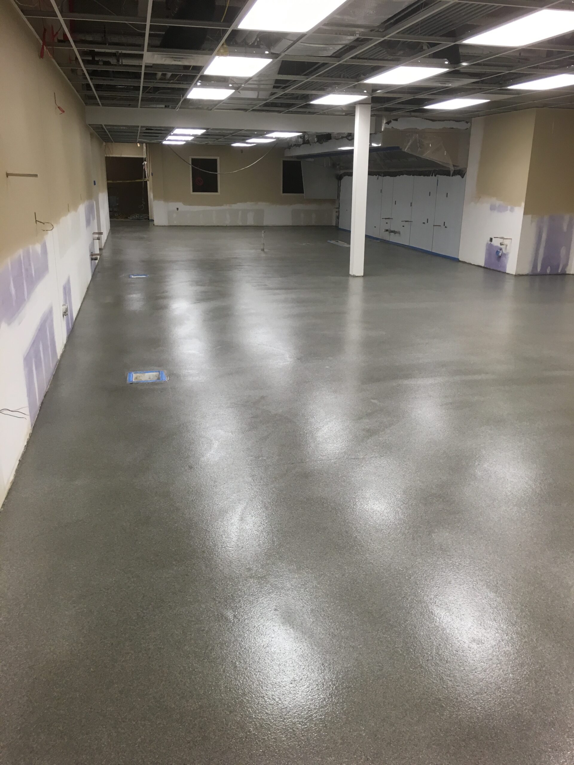 A newly installed quartz broadcast epoxy floor in a commercial kitchen. — commercial epoxy flooring benefits