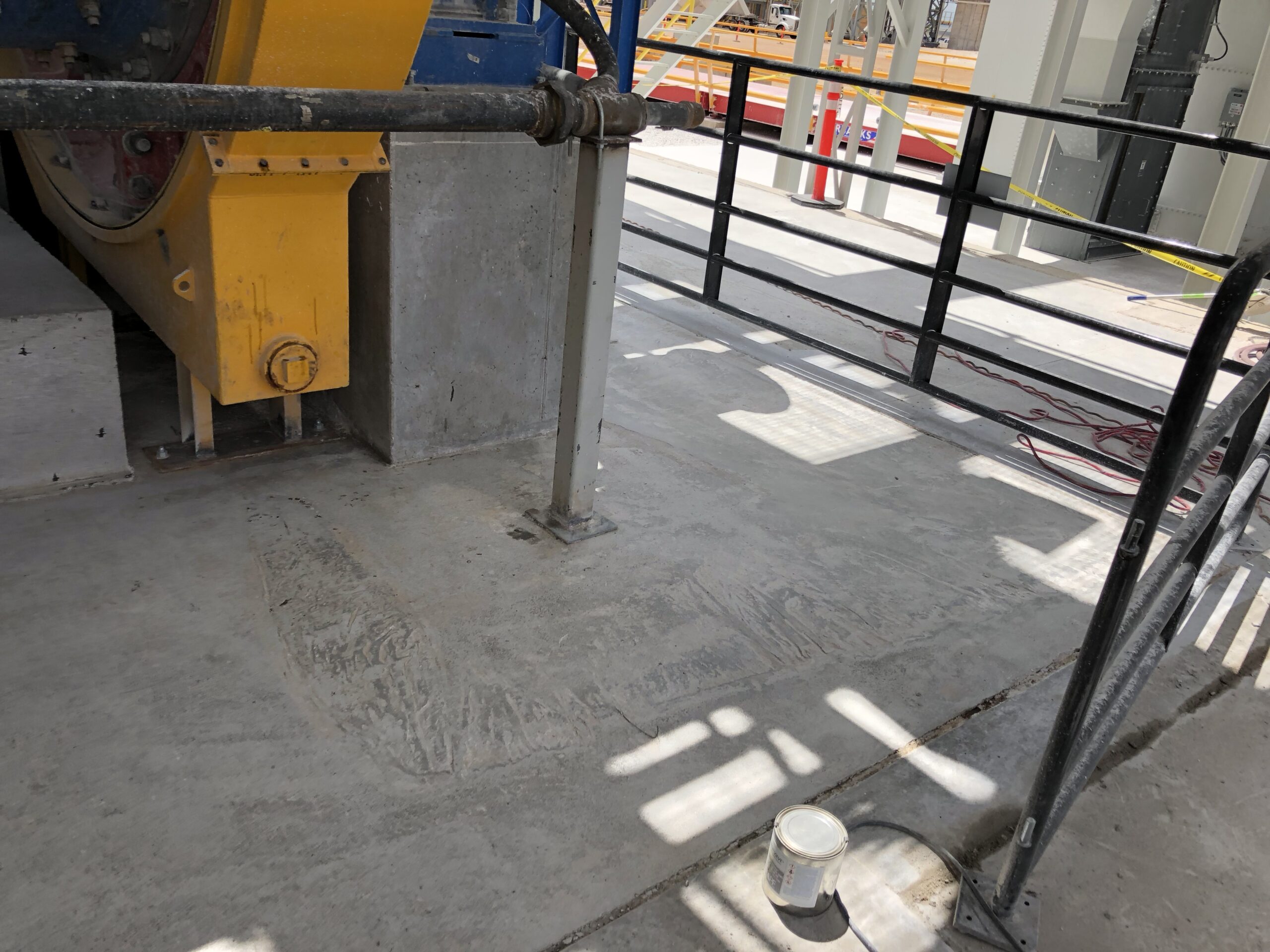 Final grind and clean of patchbacks in a concrete repair project. — concrete repair vs replacement