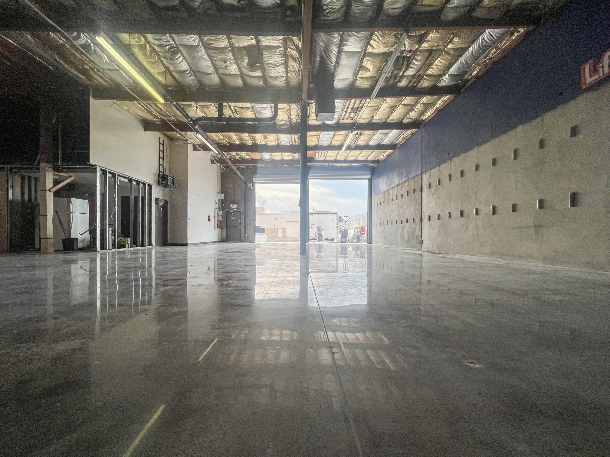 Polished concrete floor in a large industrial facility.