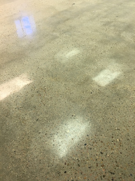 Close-up of a polished concrete floor showing a smooth finish. — how to maintain polished concrete floors