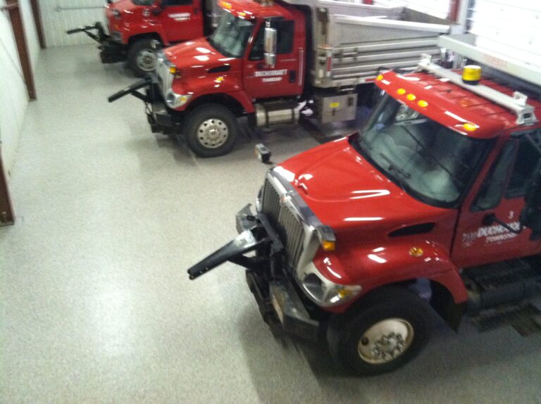 Fleet trucks on a coated maintenance garage floor — CCR install