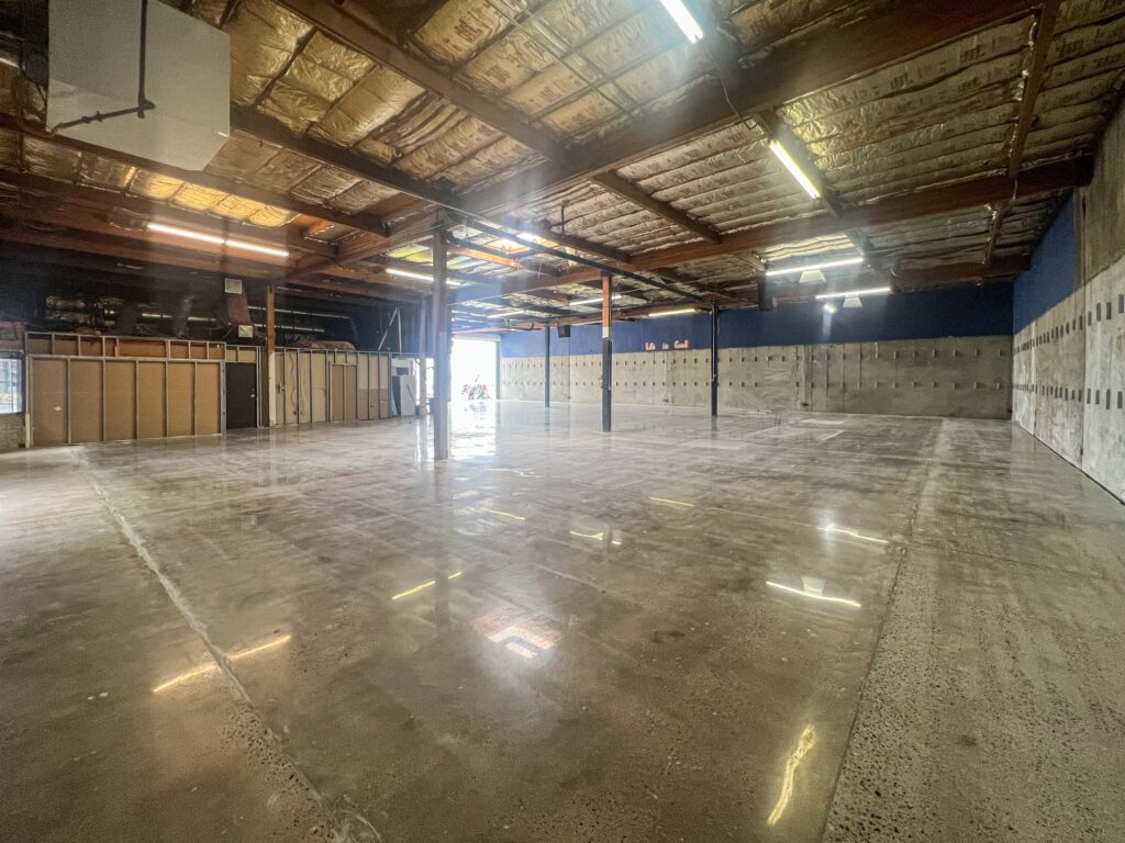 A polished concrete warehouse interior with clear space and good lighting.